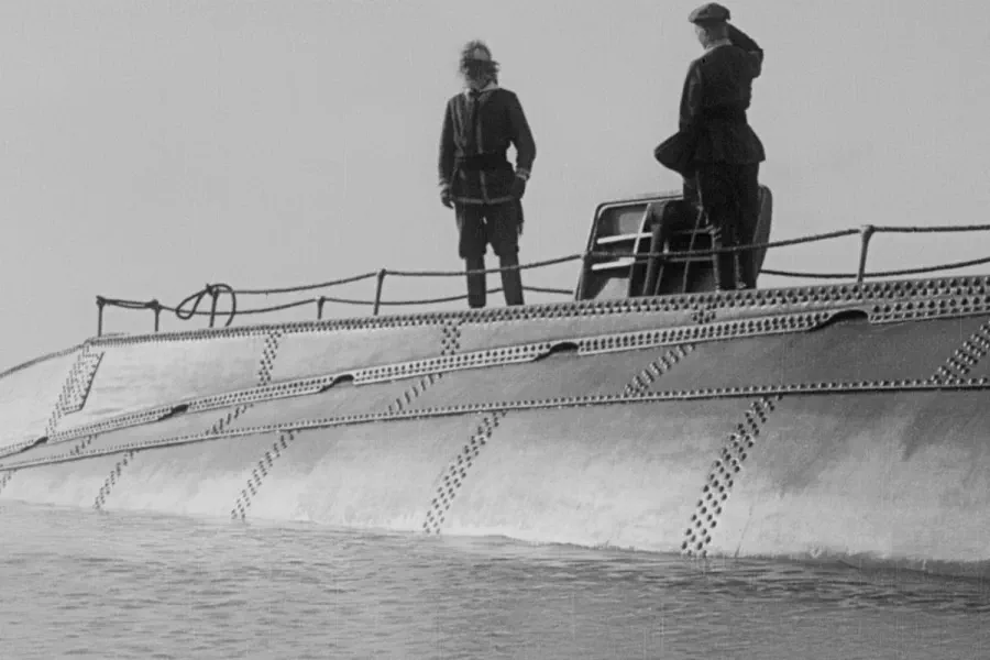 20,000 Leagues Under the Sea — two crewmen stand on the deck of a surfaced submarine in a black-and-white frame from the 1916 film. Original score by Orlando Pérez Rosso.