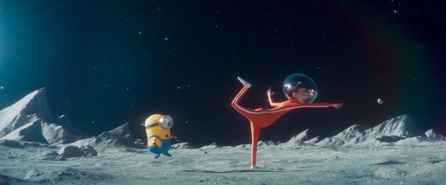 Mooned — Vector, in an orange jumpsuit and glass bubble helmet, balances upside down on the lunar surface while a Minion looks on. Original score by Orlando Pérez Rosso.